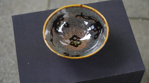 Ceramic cup with speckles reminiscent of stars